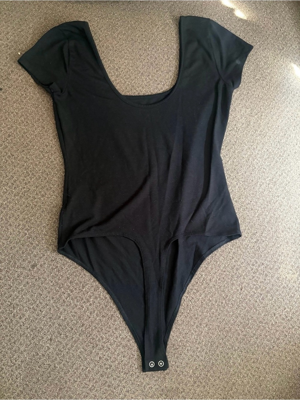 Women's black short sleeve scoop neck bodysuit